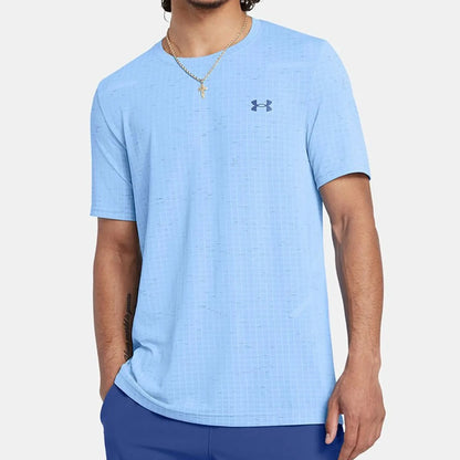 Man wearing a light blue Under Armour shirt on a white background