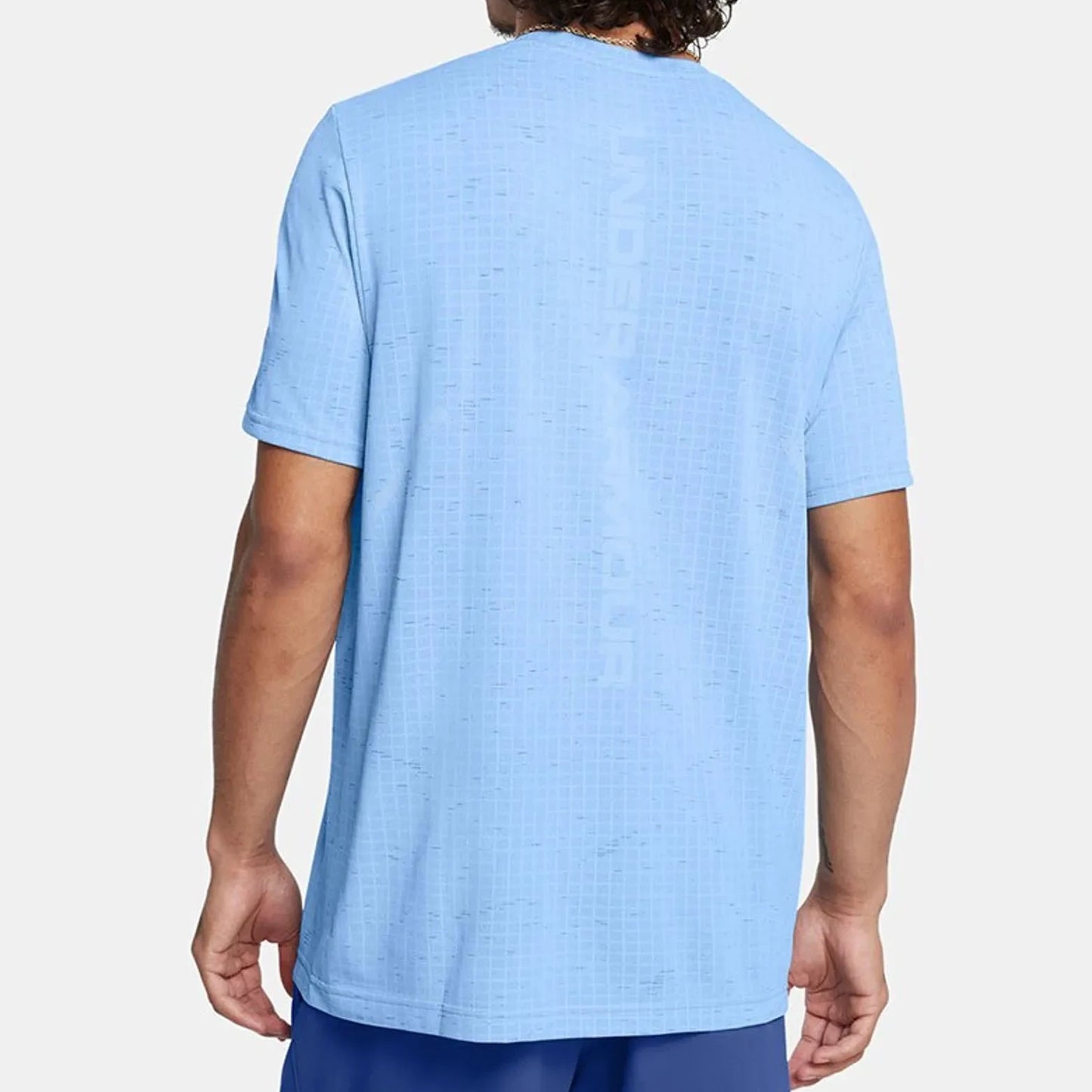 Person wearing a light blue t-shirt on a white background