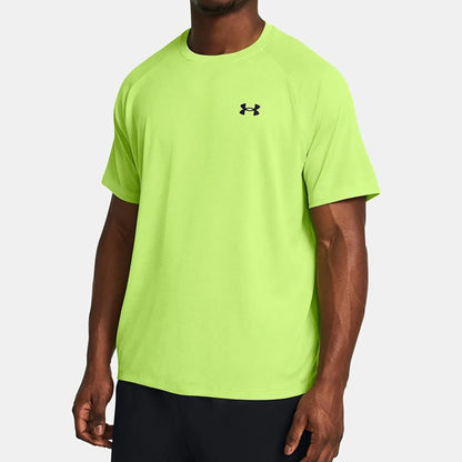 Man wearing a bright green t-shirt with a brand logo on a white background