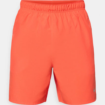 Orange shorts on a light gray background