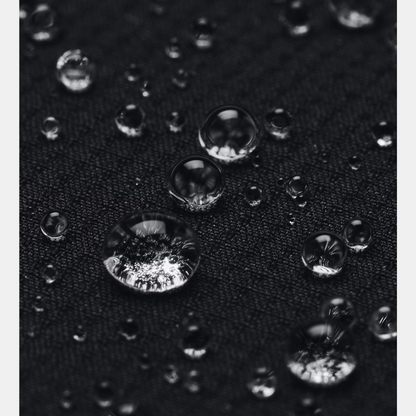 Close-up of water droplets on a textured black surface