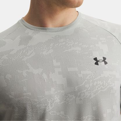 Close-up of a person wearing a gray patterned Under Armour shirt.