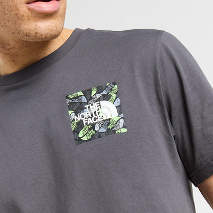 Person wearing a gray t-shirt with The North Face logo