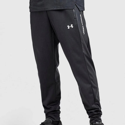 Black athletic pants with Under Armour logo on a white background