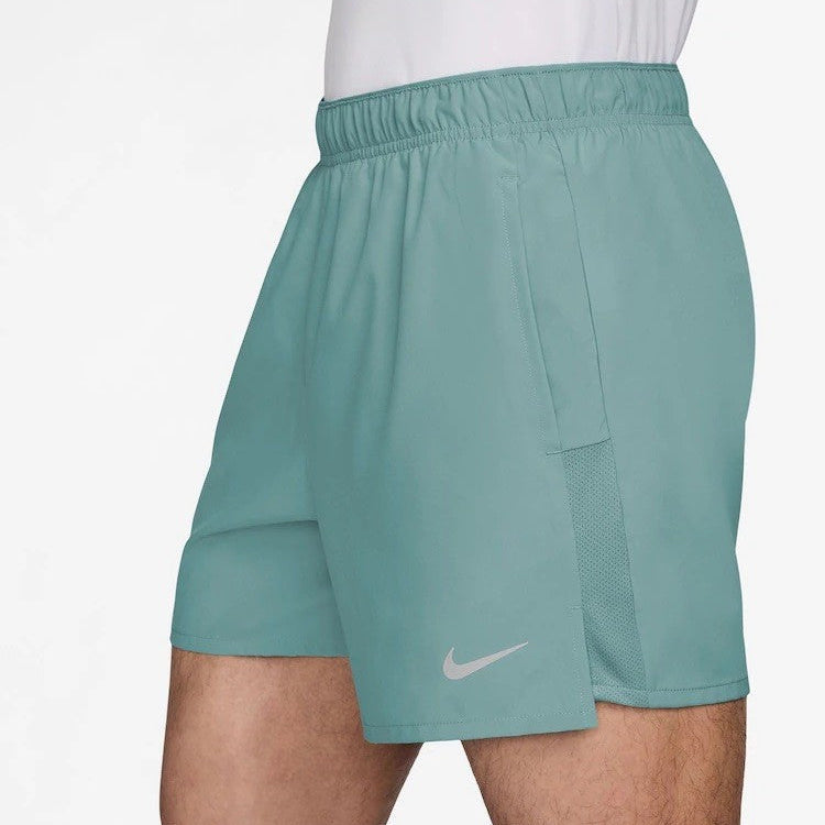 Teal athletic shorts with a Nike logo on a white background
